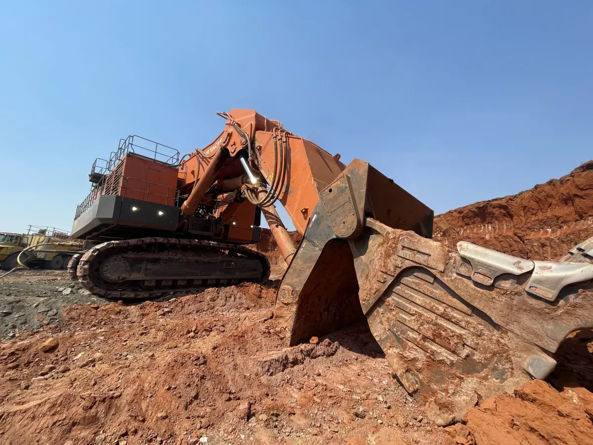 Large tracked mining excavator in an open-cut mine, showing the scale and harsh environment SmartRoller was designed for.